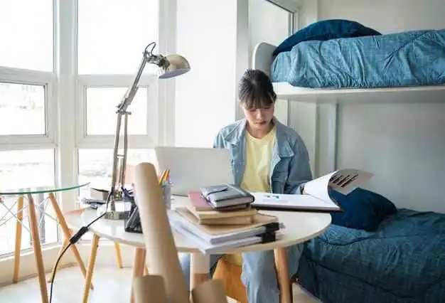 Girl studying in a comfortable dormitory